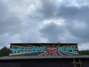 Photo Description: Welcome Home mural on the side of a building leading into the Quiet Valley Ranch campground.